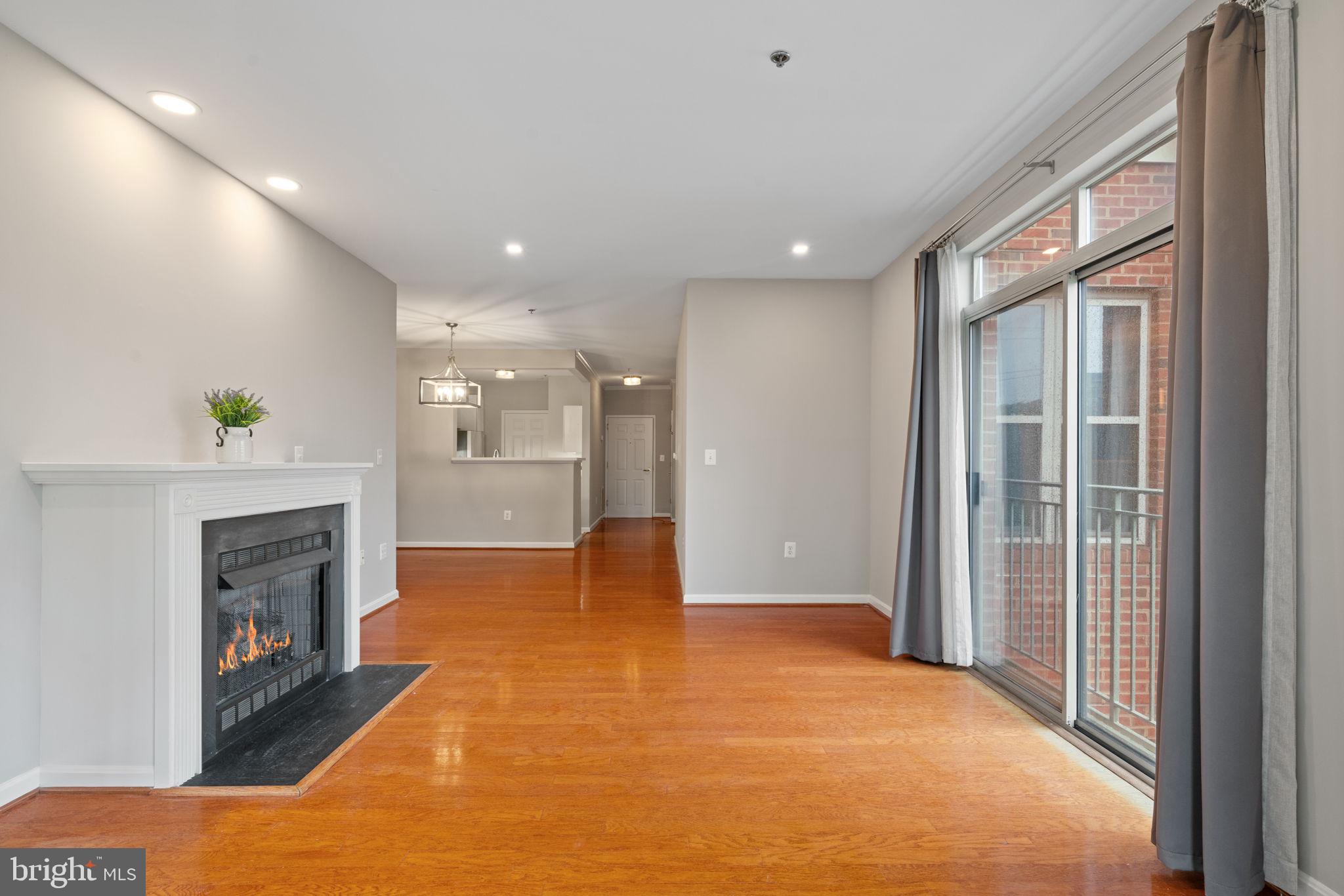 1860 Stratford Park Place, Unit 305 Reston, VA 20190 - Photo 14 of 35 Living Room with Gas Fireplace