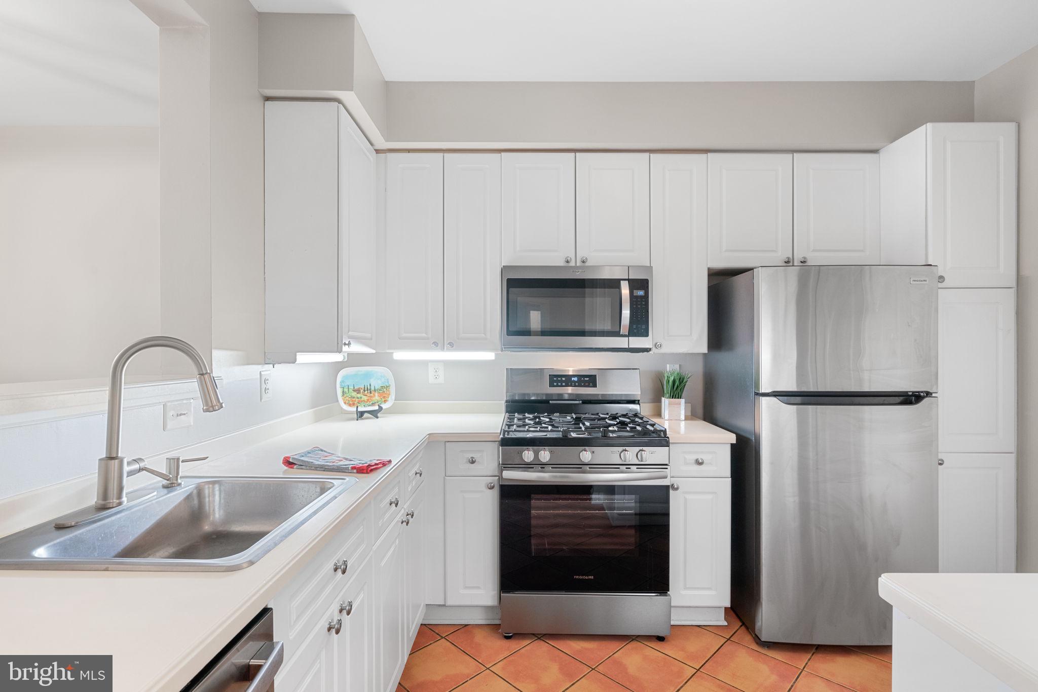 1860 Stratford Park Place, Unit 305 Reston, VA 20190 - Photo 16 of 35 Kitchen with brand new Refrigerator and Oven/Range