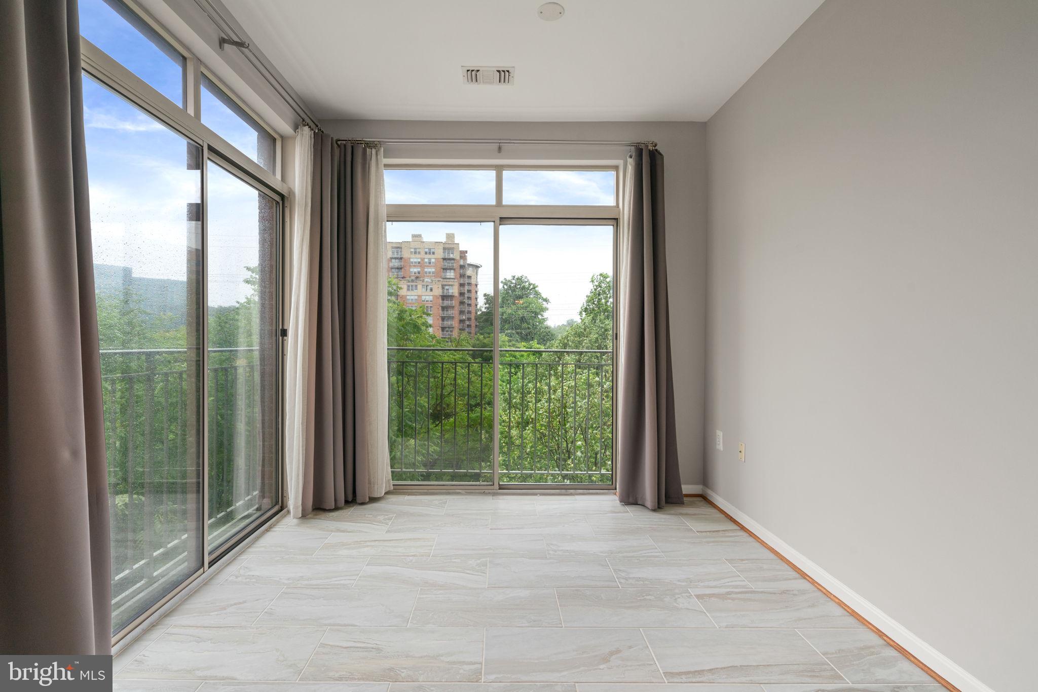 1860 Stratford Park Place, Unit 305 Reston, VA 20190 - Photo 25 of 35 Bright, tiled Sunroom