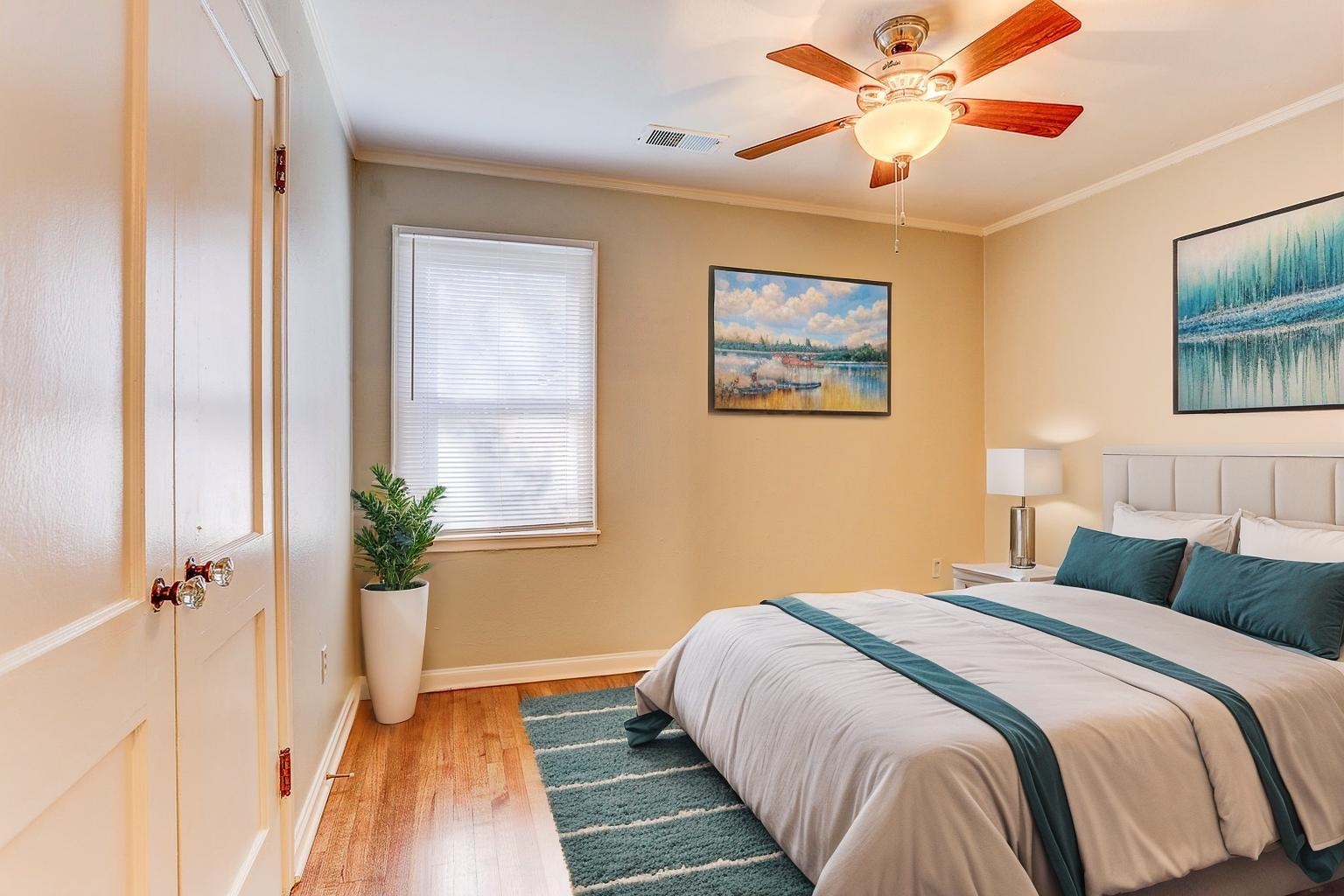 1369 Marcia Road Memphis, TN 38117 - Photo 19 of 25 a bedroom with a large bed and a chandelier