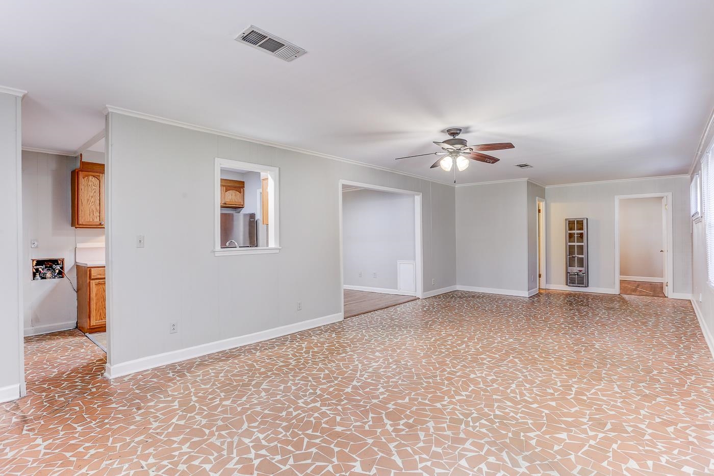 1369 Marcia Road Memphis, TN 38117 - Photo 6 of 25 a view of a livingroom with a ceiling fan and window