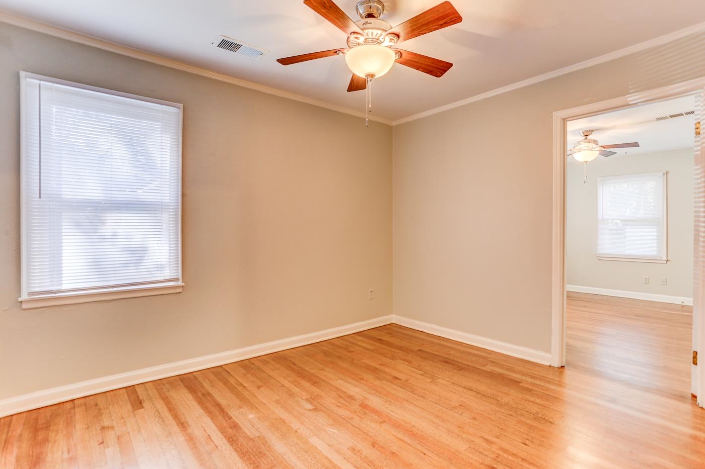 1369 Marcia Road Memphis, TN 38117 - Photo 7 of 25 wooden floor in an empty room with a window