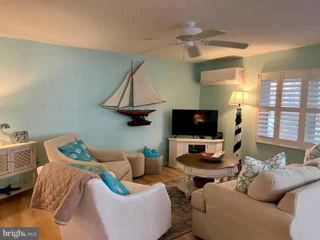 a balcony with furniture and wooden floor