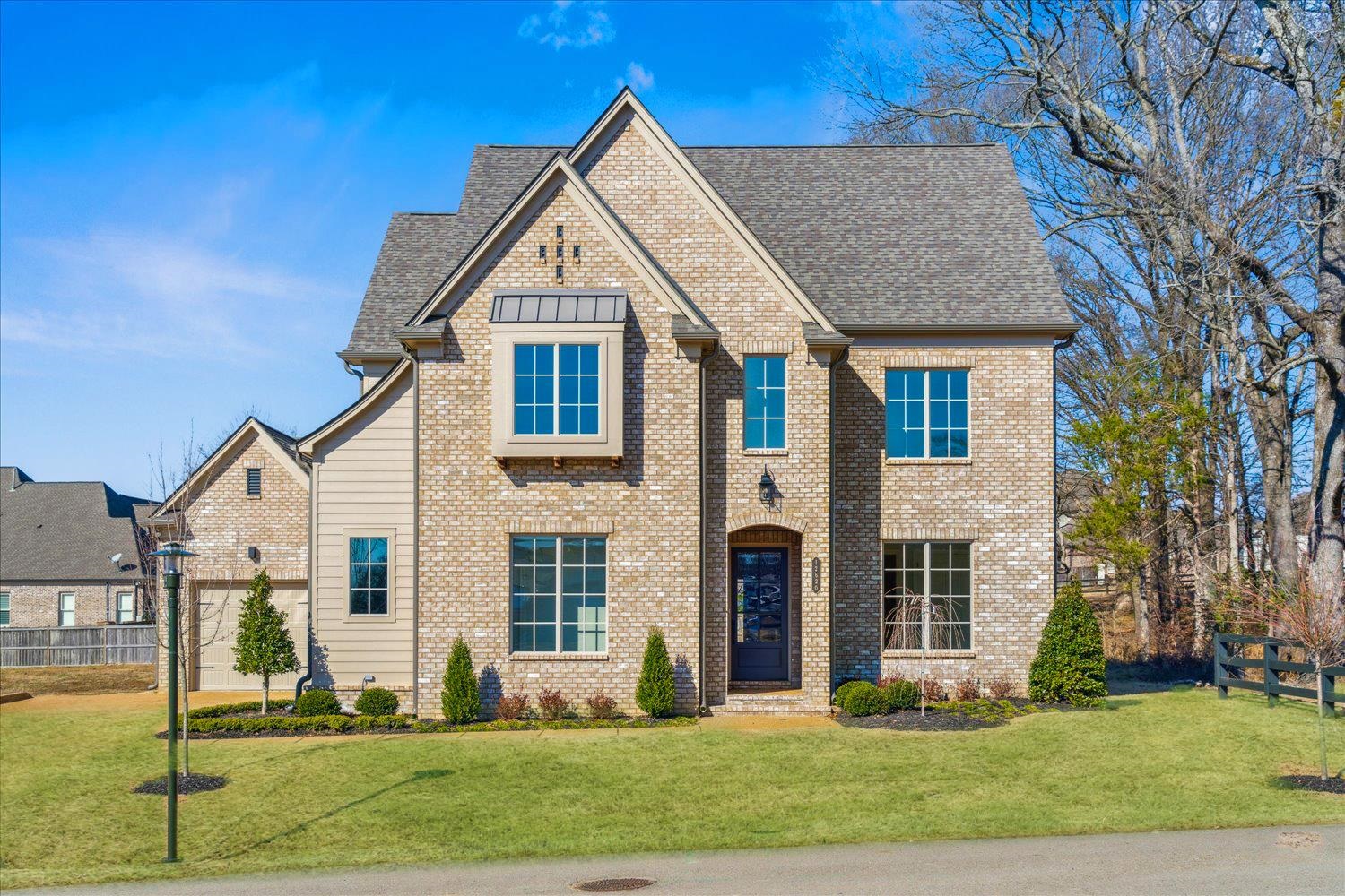 12620 Miss Cloud Road Collierville, TN 38017 - Photo 1 of 38 View of front facade with a front lawn, a shingled roof, and brick siding