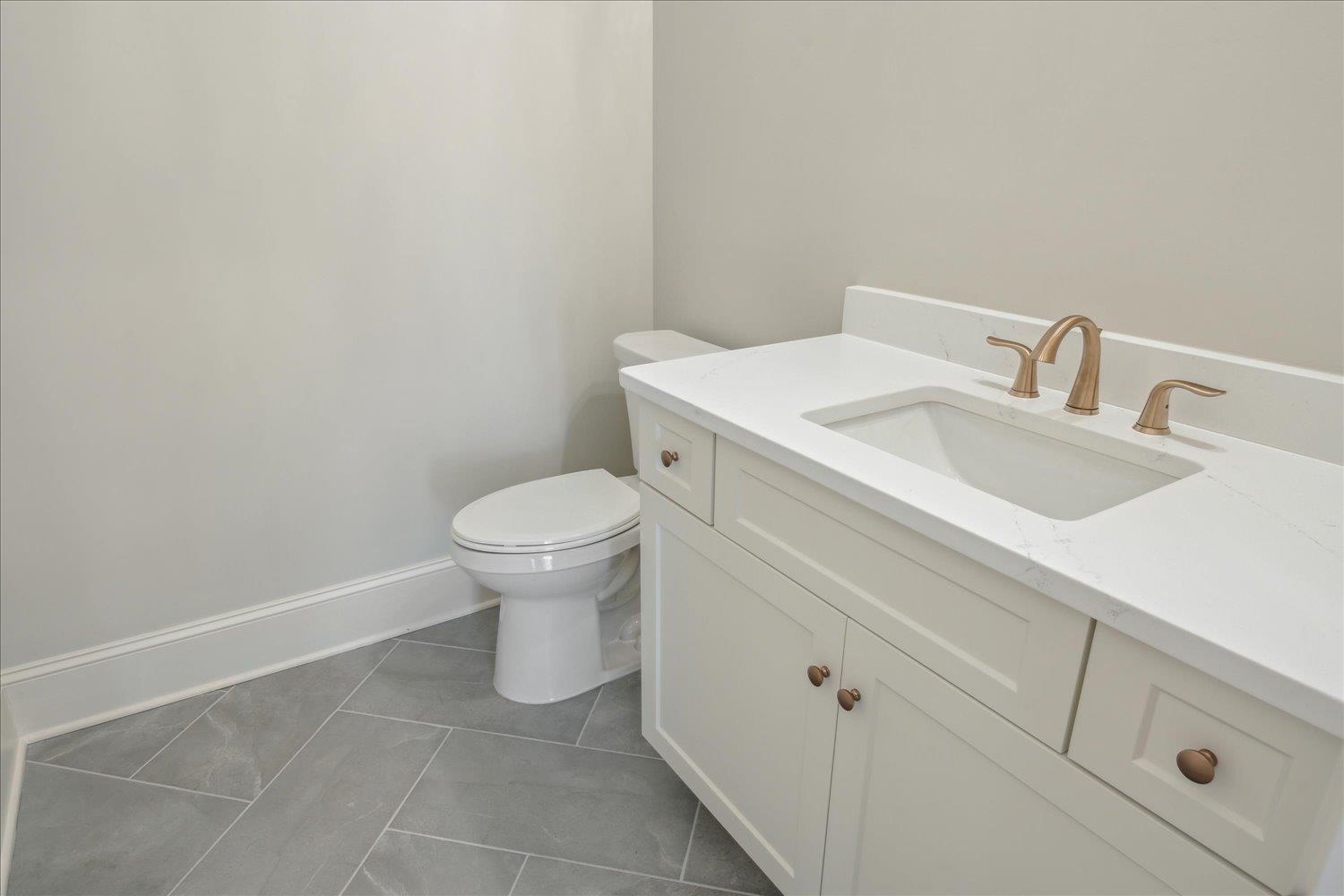 12620 Miss Cloud Road Collierville, TN 38017 - Photo 20 of 38 Bathroom featuring tile patterned flooring, vanity, and toilet
