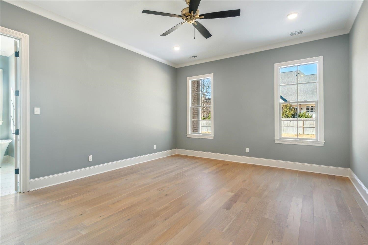 12620 Miss Cloud Road Collierville, TN 38017 - Photo 21 of 38 Spare room with light wood-type flooring, ceiling fan, and crown molding
