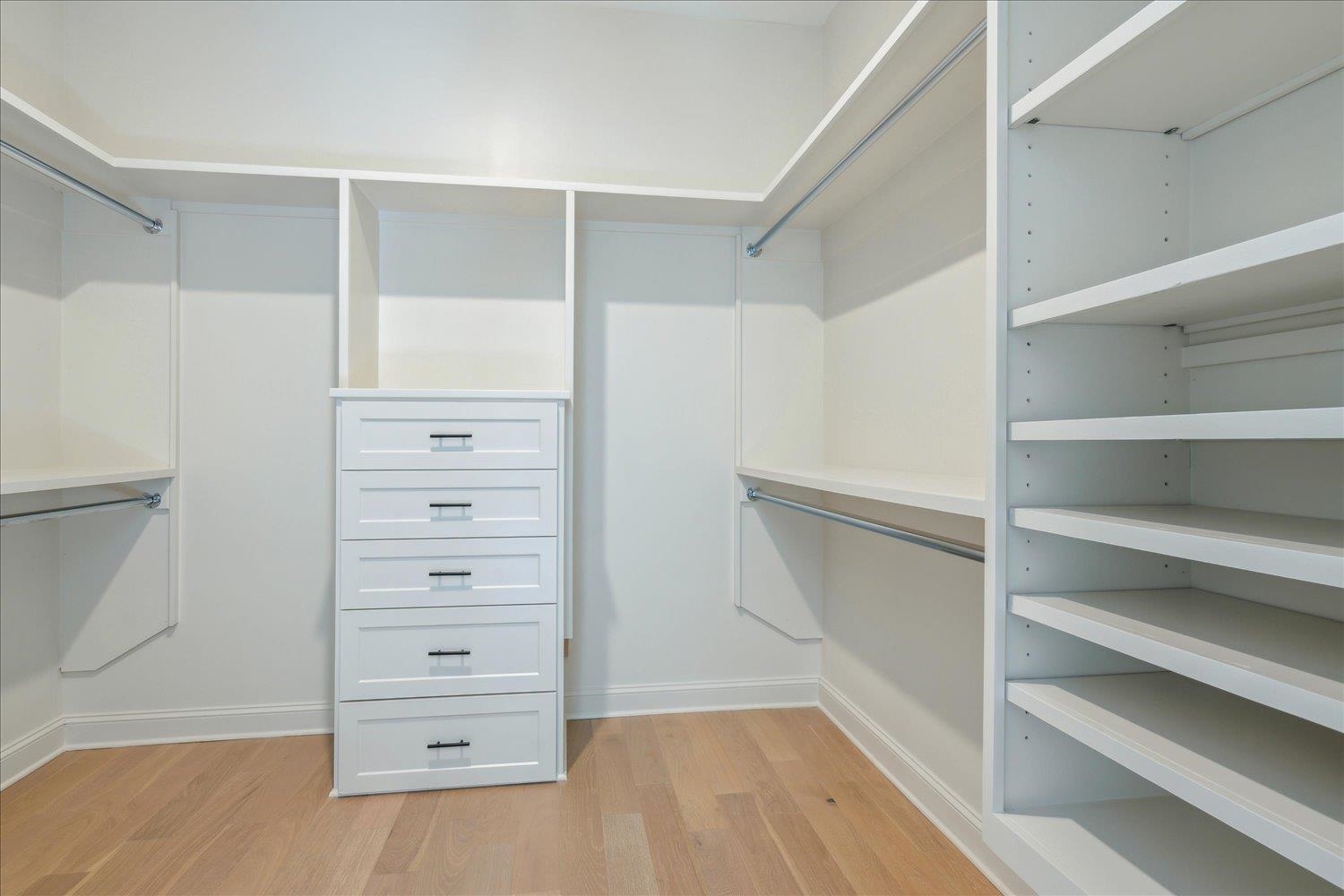 12620 Miss Cloud Road Collierville, TN 38017 - Photo 24 of 38 Walk in closet with light hardwood / wood-style flooring