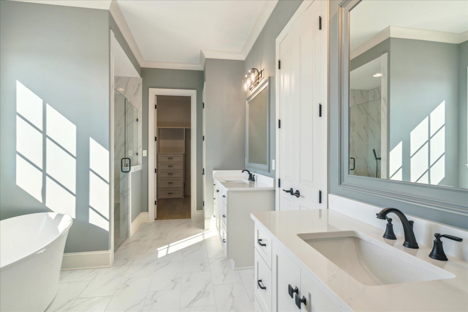12620 Miss Cloud Road Collierville, TN 38017 - Photo 25 of 38 Bathroom featuring vanity, ornamental molding, and separate shower and tub