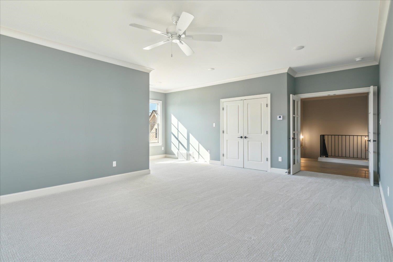 12620 Miss Cloud Road Collierville, TN 38017 - Photo 29 of 38 Interior space featuring ornamental molding, ceiling fan, and light carpet