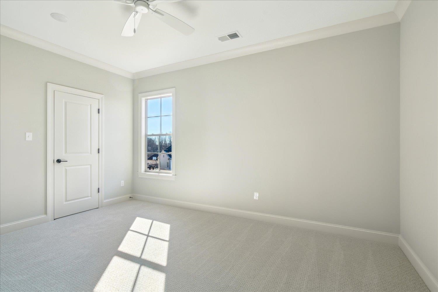 12620 Miss Cloud Road Collierville, TN 38017 - Photo 30 of 38 Carpeted empty room with ceiling fan and crown molding