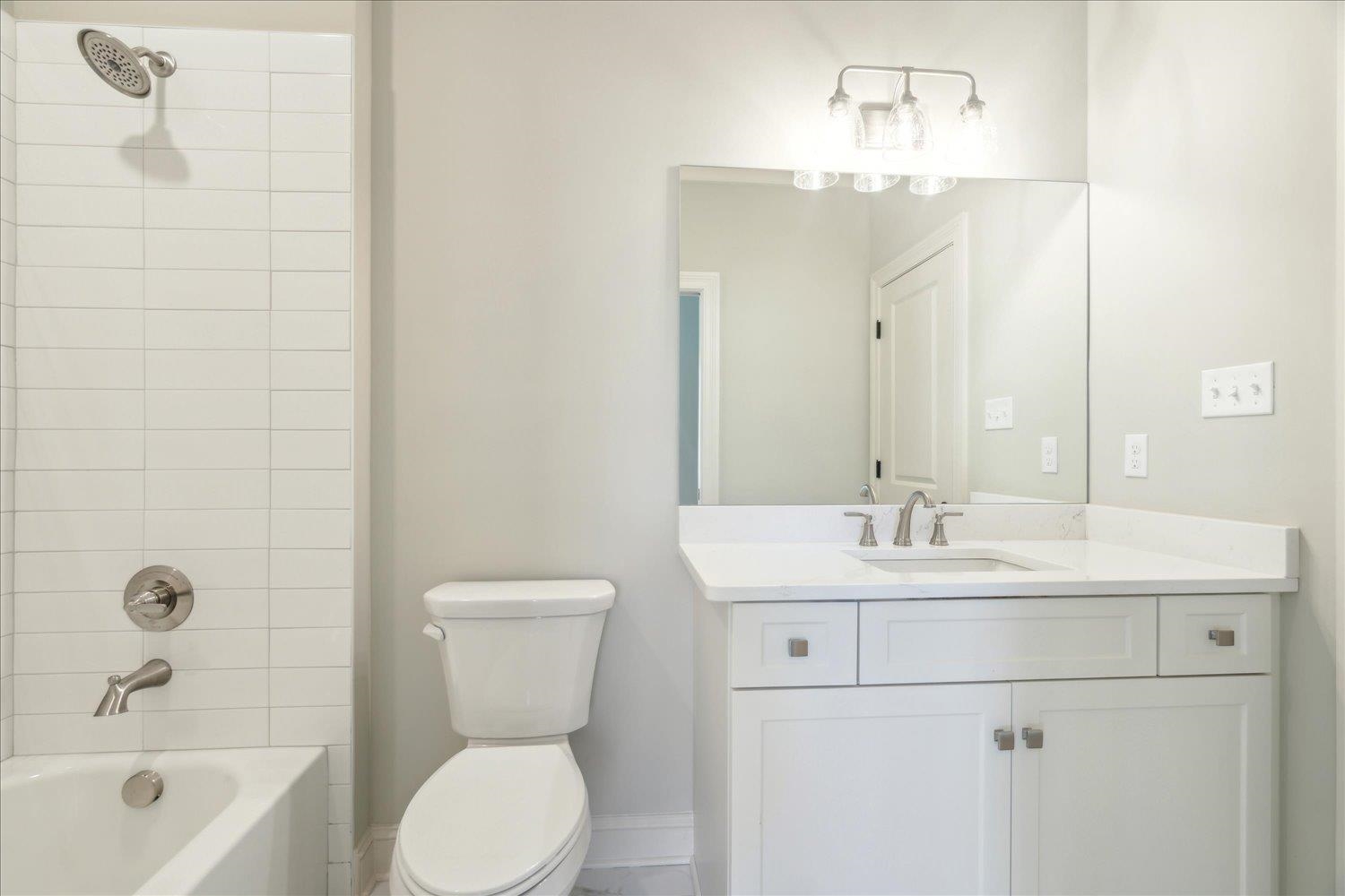 12620 Miss Cloud Road Collierville, TN 38017 - Photo 34 of 38 Full bathroom featuring toilet, tiled shower / bath combo, and vanity
