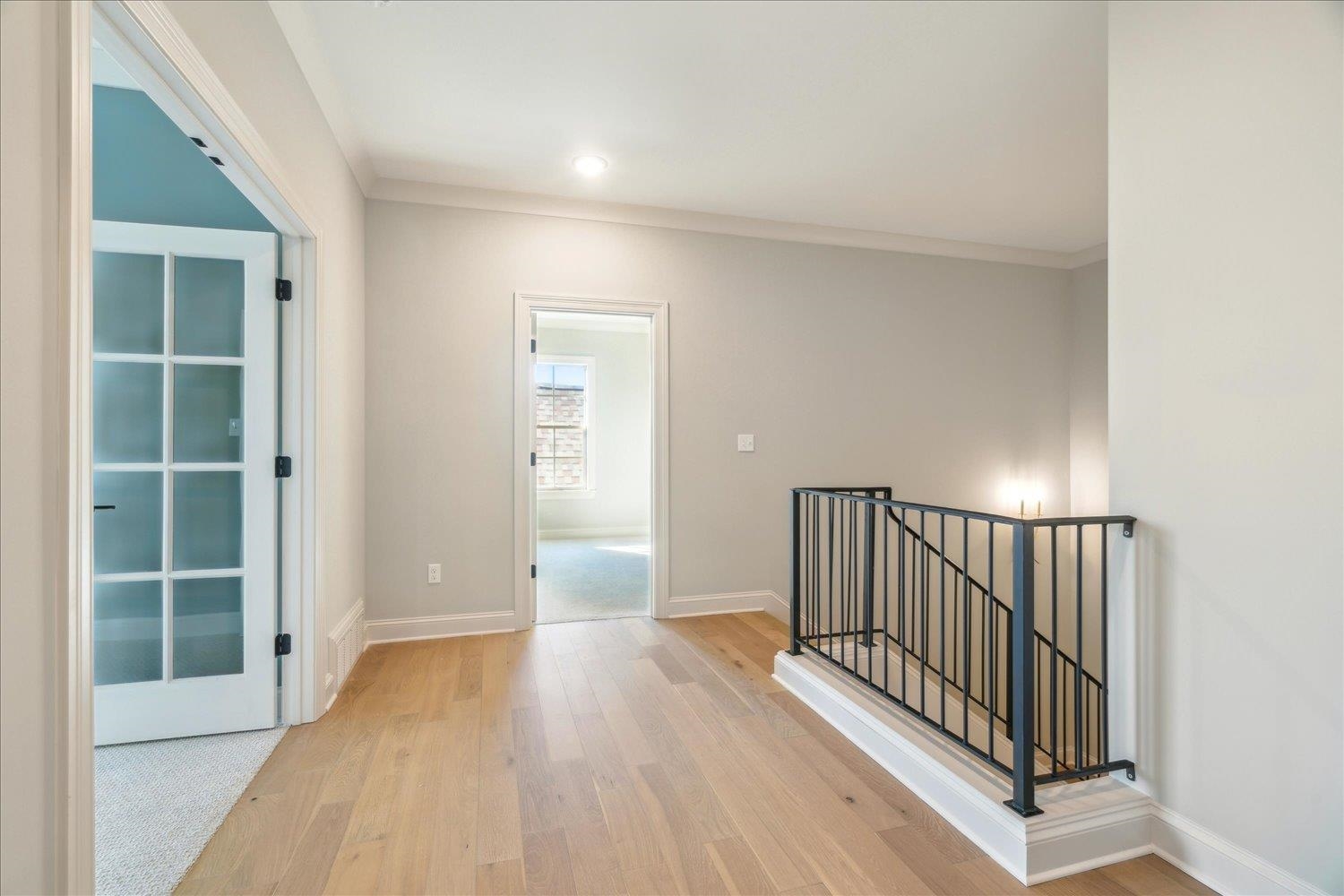 12620 Miss Cloud Road Collierville, TN 38017 - Photo 35 of 38 Corridor featuring ornamental molding and light hardwood / wood-style flooring
