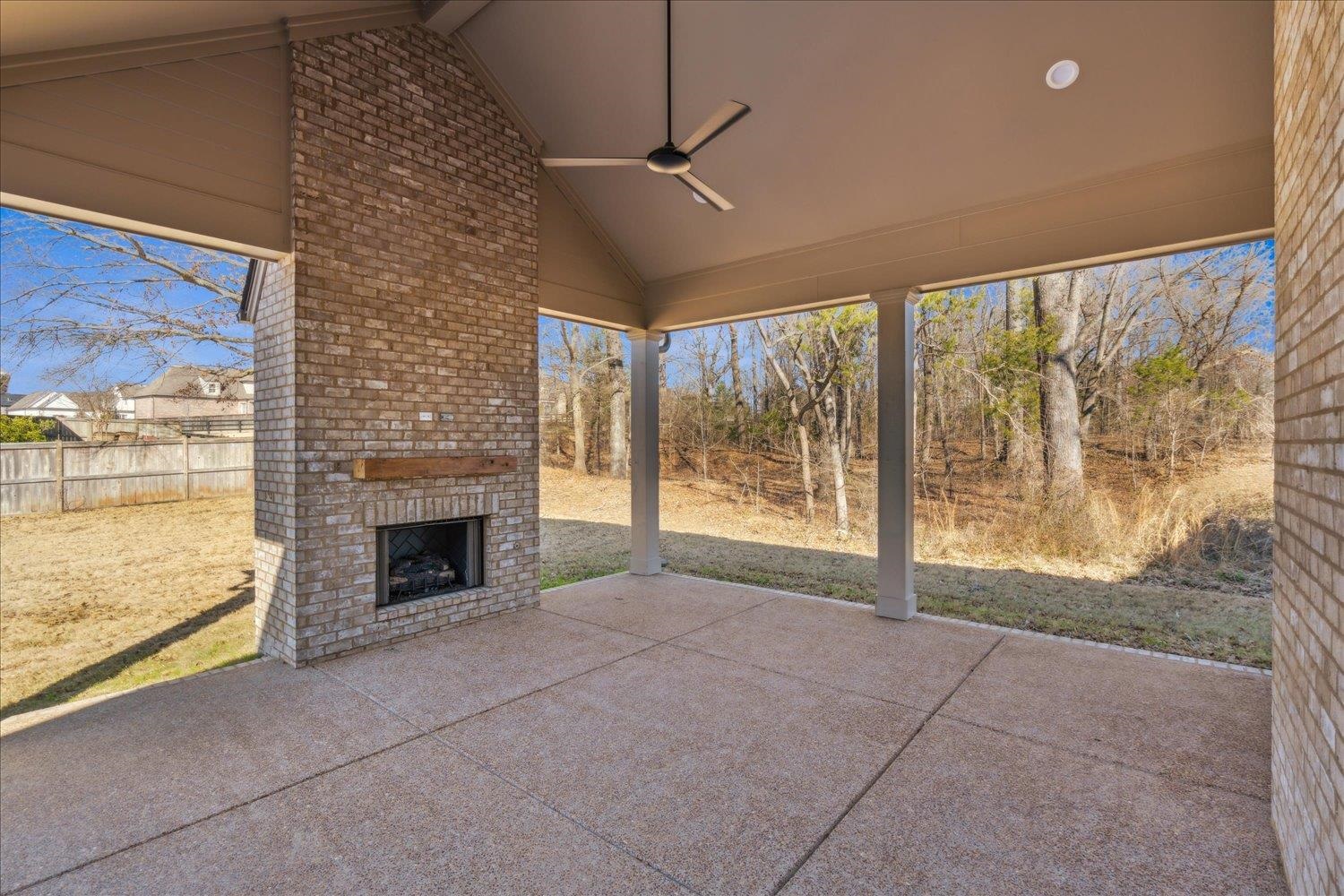 12620 Miss Cloud Road Collierville, TN 38017 - Photo 36 of 38 View of patio / terrace with ceiling fan and an outdoor brick fireplace
