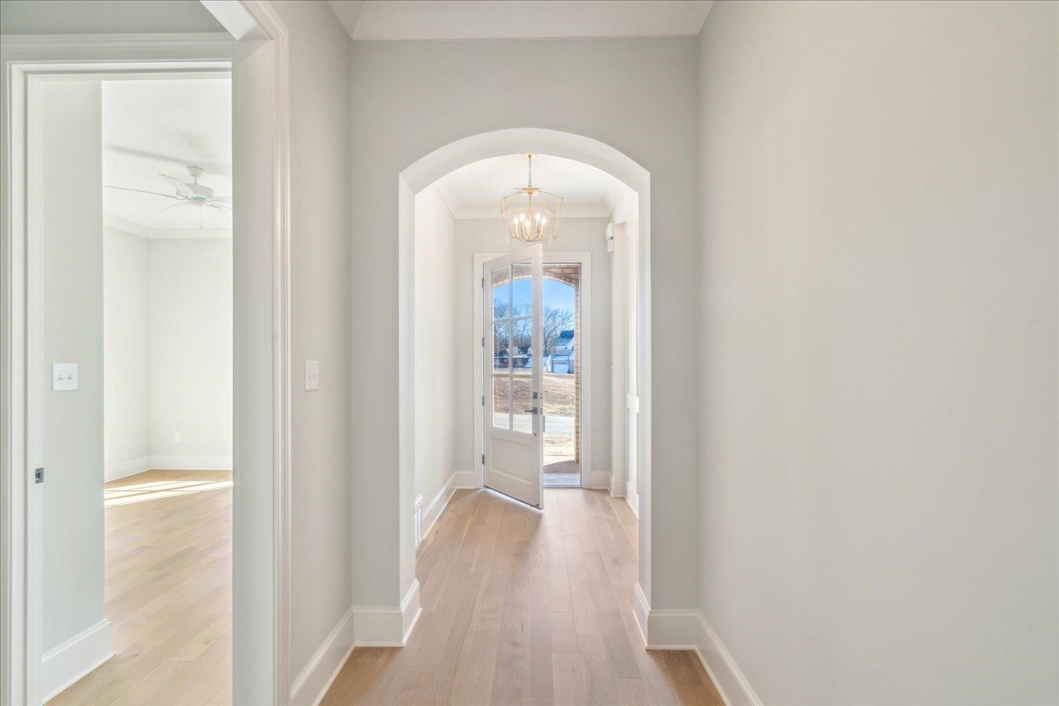 12620 Miss Cloud Road Collierville, TN 38017 - Photo 6 of 38 Corridor with light wood-type flooring and crown molding
