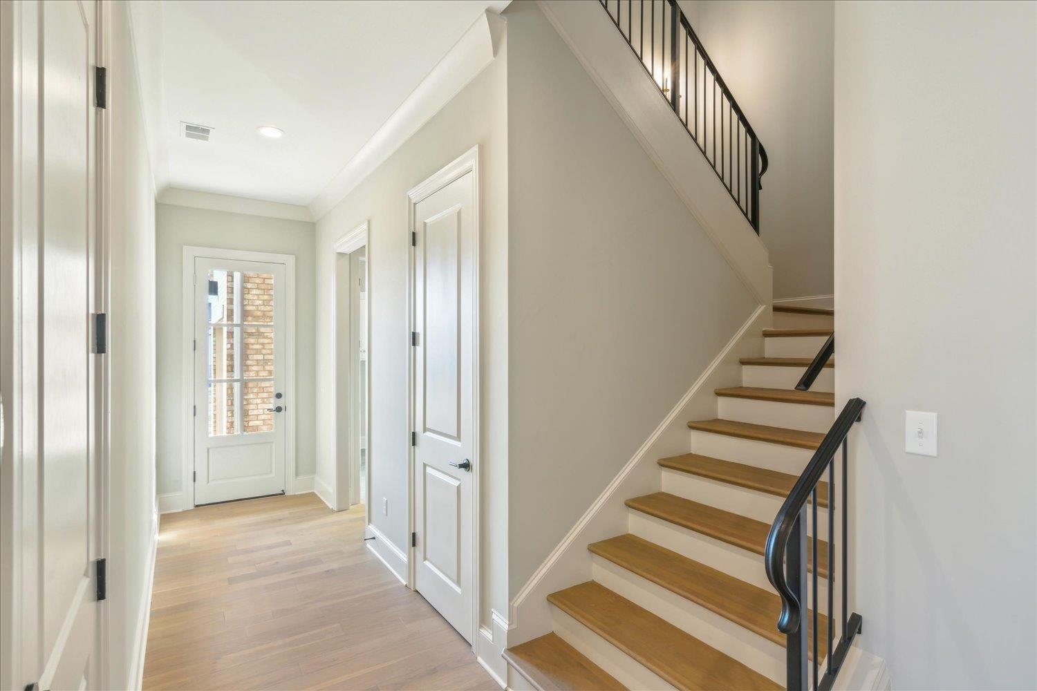 12620 Miss Cloud Road Collierville, TN 38017 - Photo 7 of 38 Staircase featuring hardwood / wood-style flooring and crown molding