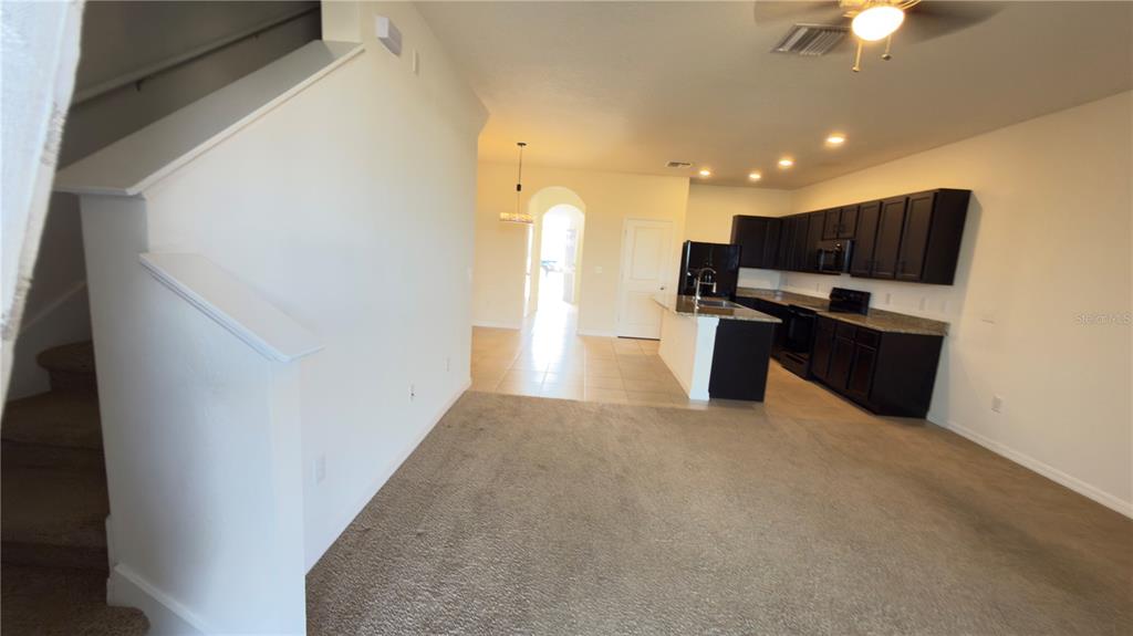 1881 Hovenweep Road Wesley Chapel, FL 33543 - Photo 11 of 18 a view of kitchen appliances and a chandelier fan