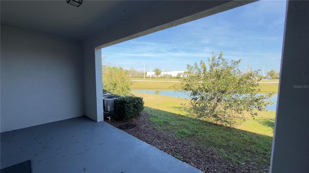 1881 Hovenweep Road Wesley Chapel, FL 33543 - Photo 12 of 18 a view of a floor to ceiling window next to a yard