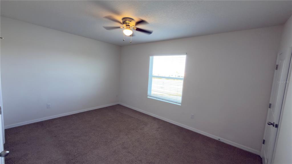 1881 Hovenweep Road Wesley Chapel, FL 33543 - Photo 13 of 18 an empty room with a window