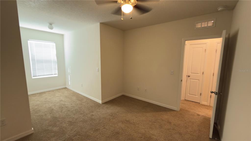 1881 Hovenweep Road Wesley Chapel, FL 33543 - Photo 15 of 18 an empty room with a window