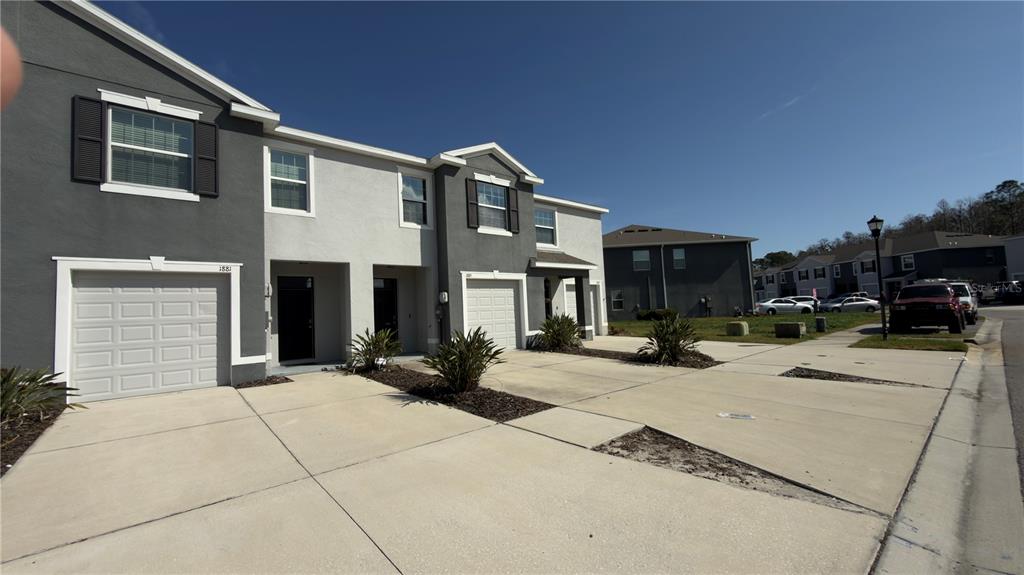 1881 Hovenweep Road Wesley Chapel, FL 33543 - Photo 2 of 18 a view of a building with sitting area