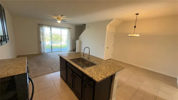 a view of a floor to ceiling window next to a yard