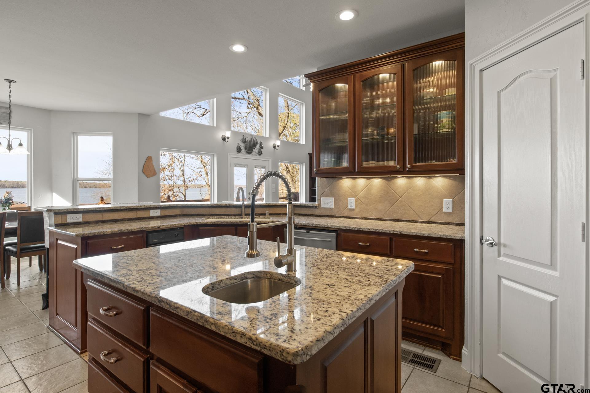 59 Private Road Pittsburg, TX 75686 - Photo 15 of 45 a kitchen with a sink a counter space and living room