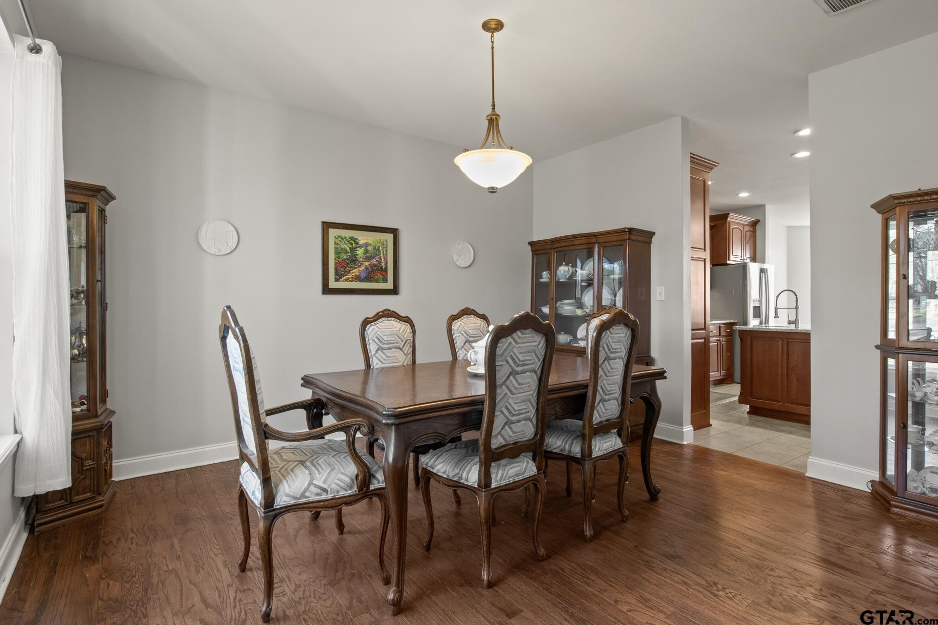 59 Private Road Pittsburg, TX 75686 - Photo 19 of 45 a view of a a dining room with furniture window and wooden floor
