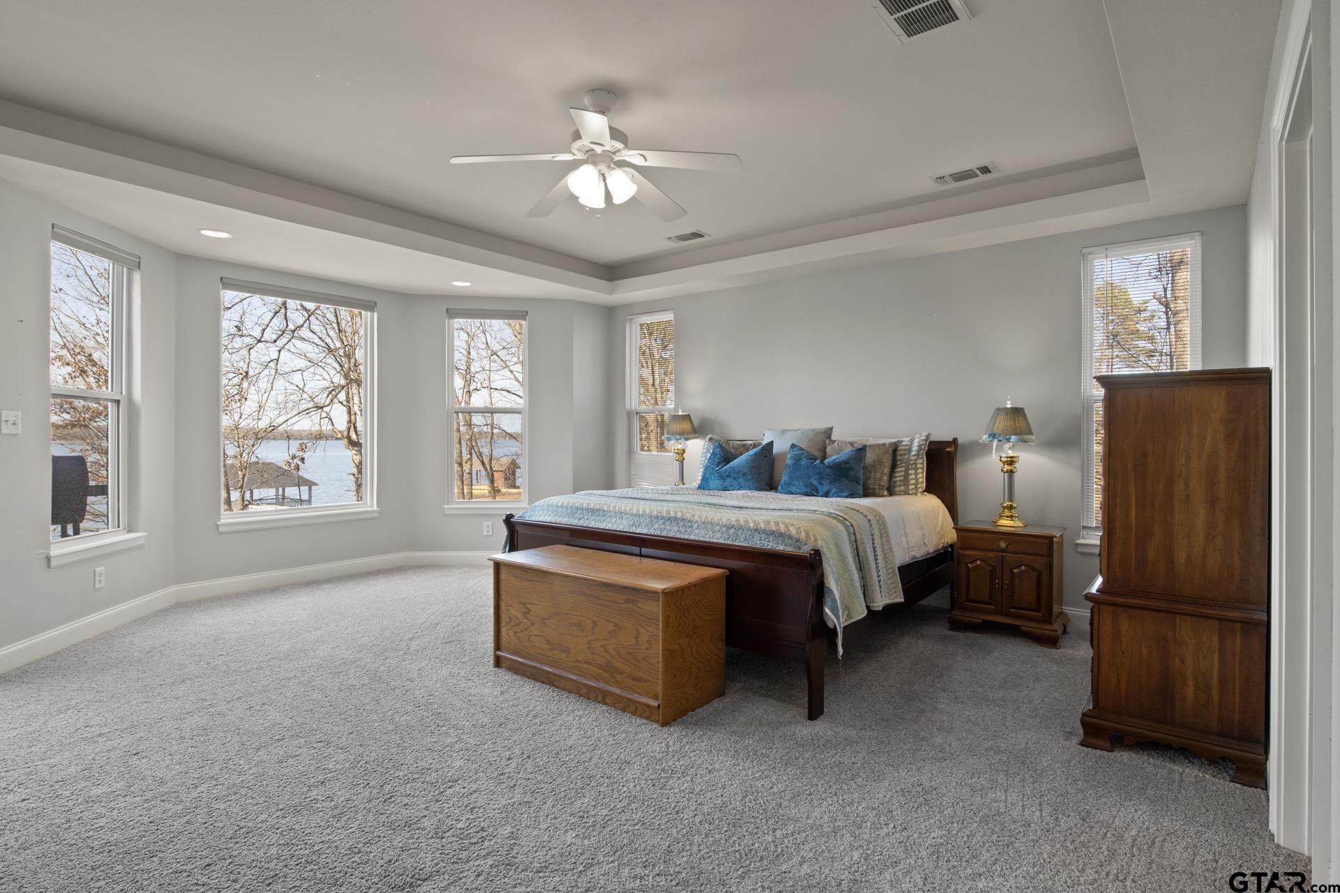 59 Private Road Pittsburg, TX 75686 - Photo 20 of 45 a spacious bedroom with a bed and window