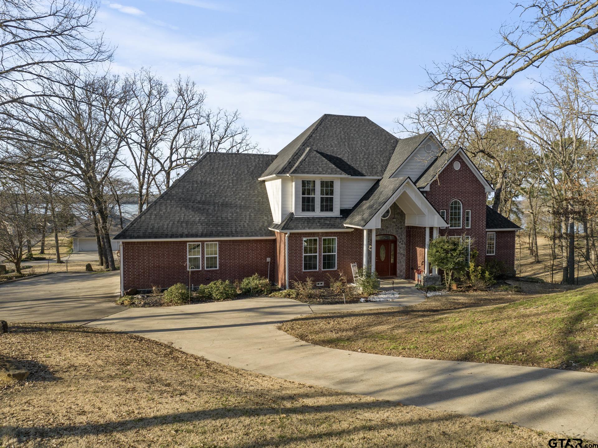 59 Private Road Pittsburg, TX 75686 - Photo 2 of 45 a front view of a house with a yard