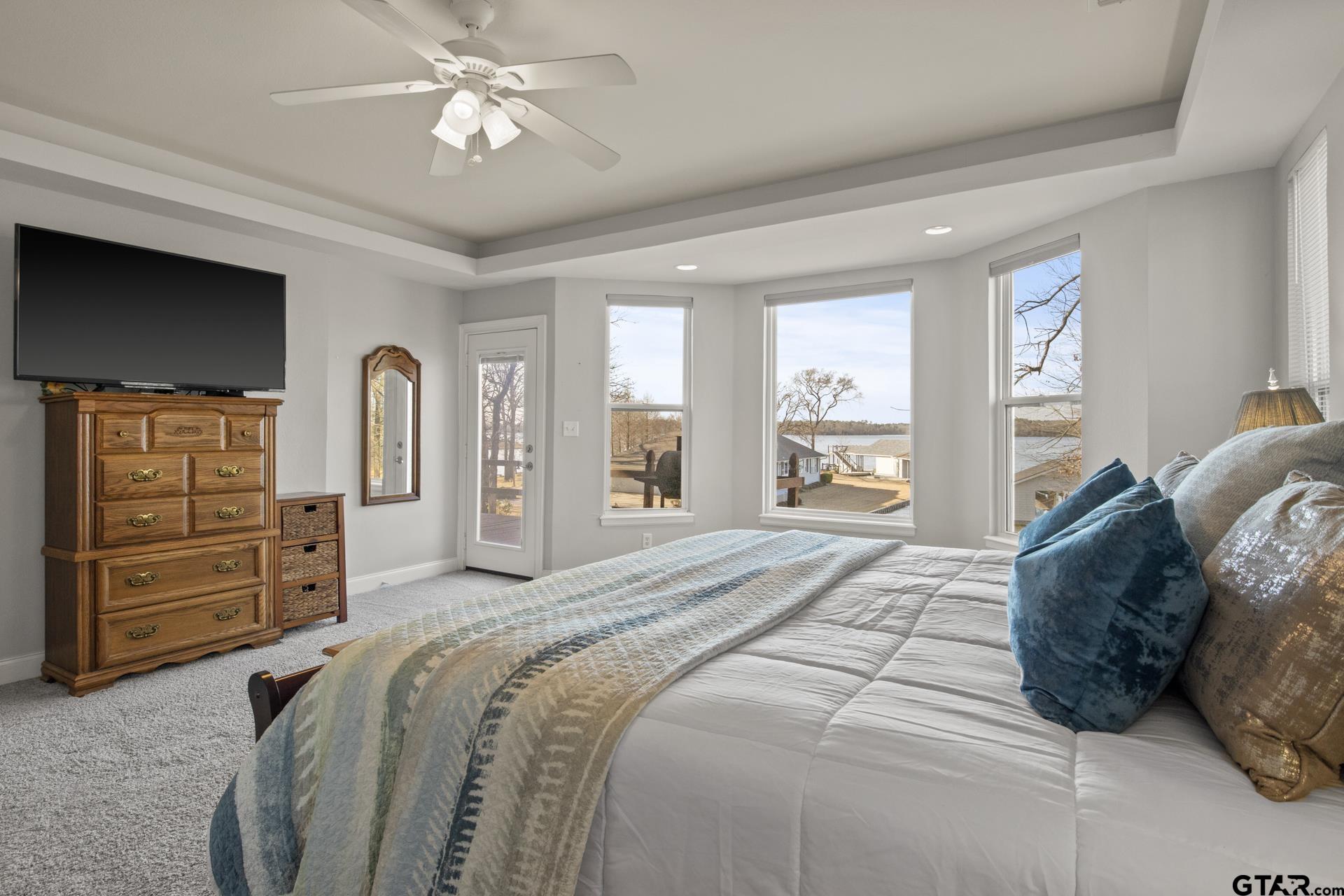 59 Private Road Pittsburg, TX 75686 - Photo 22 of 45 a spacious bedroom with a large bed and a dresser