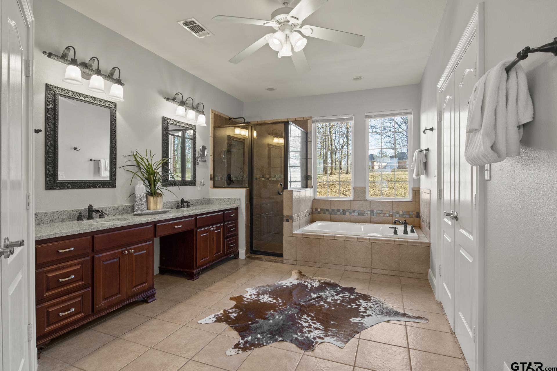 59 Private Road Pittsburg, TX 75686 - Photo 23 of 45 a bathroom with a tub sink shower and mirror
