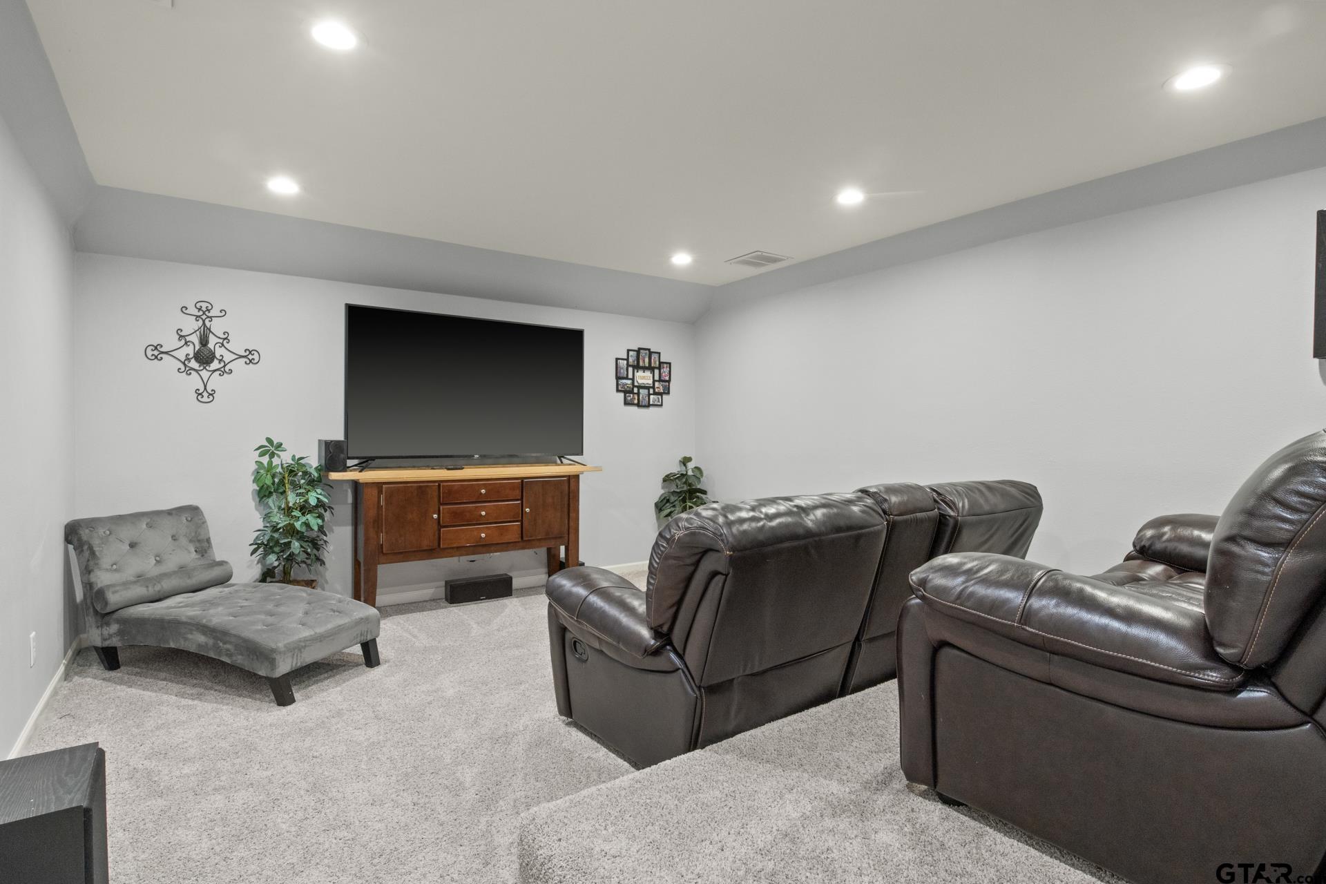 59 Private Road Pittsburg, TX 75686 - Photo 27 of 45 a living room with furniture and a flat screen tv