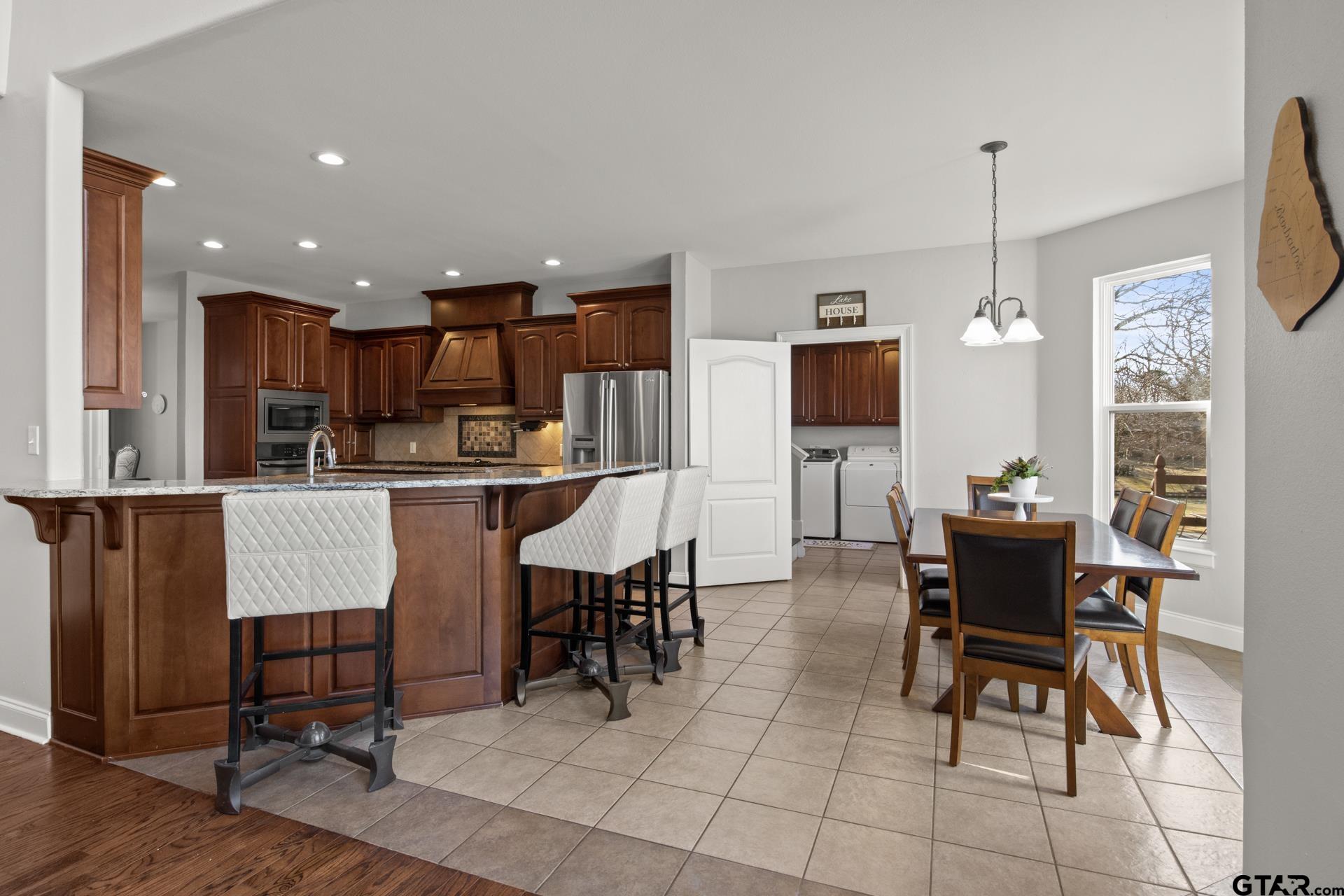 59 Private Road Pittsburg, TX 75686 - Photo 10 of 45 a living room with stainless steel appliances kitchen island granite countertop furniture and a view of kitchen