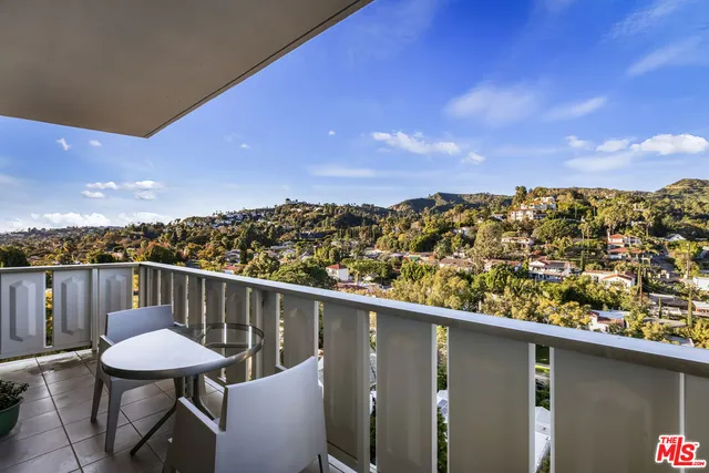 a view of a chairs and table in patio