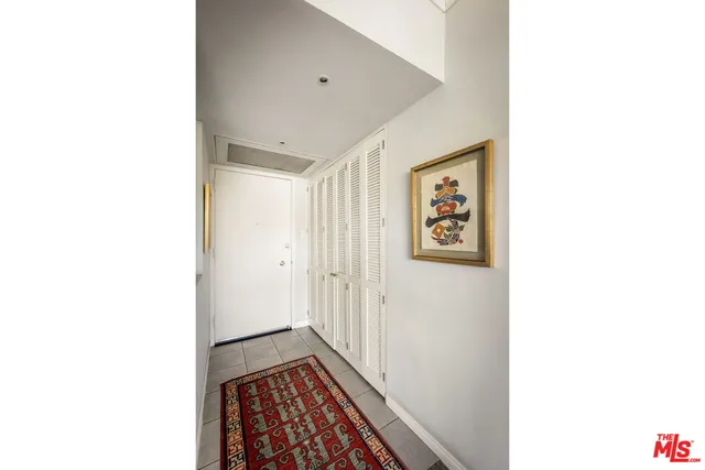 a view of a hallway with paintings on the wall