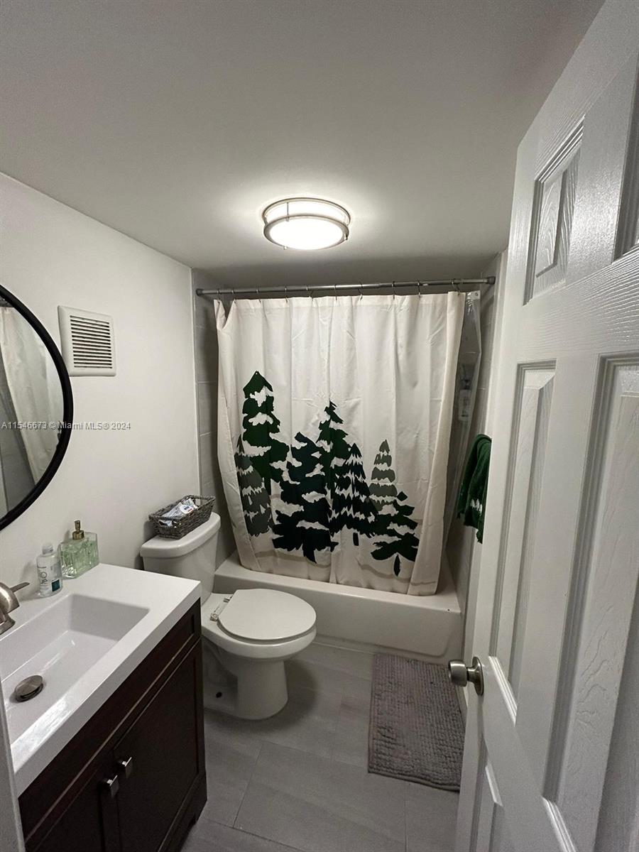 8550 Southwest 109th Avenue, Unit 5119 Miami, FL 33173 - Photo 11 of 14 a bathroom with a sink toilet and shower