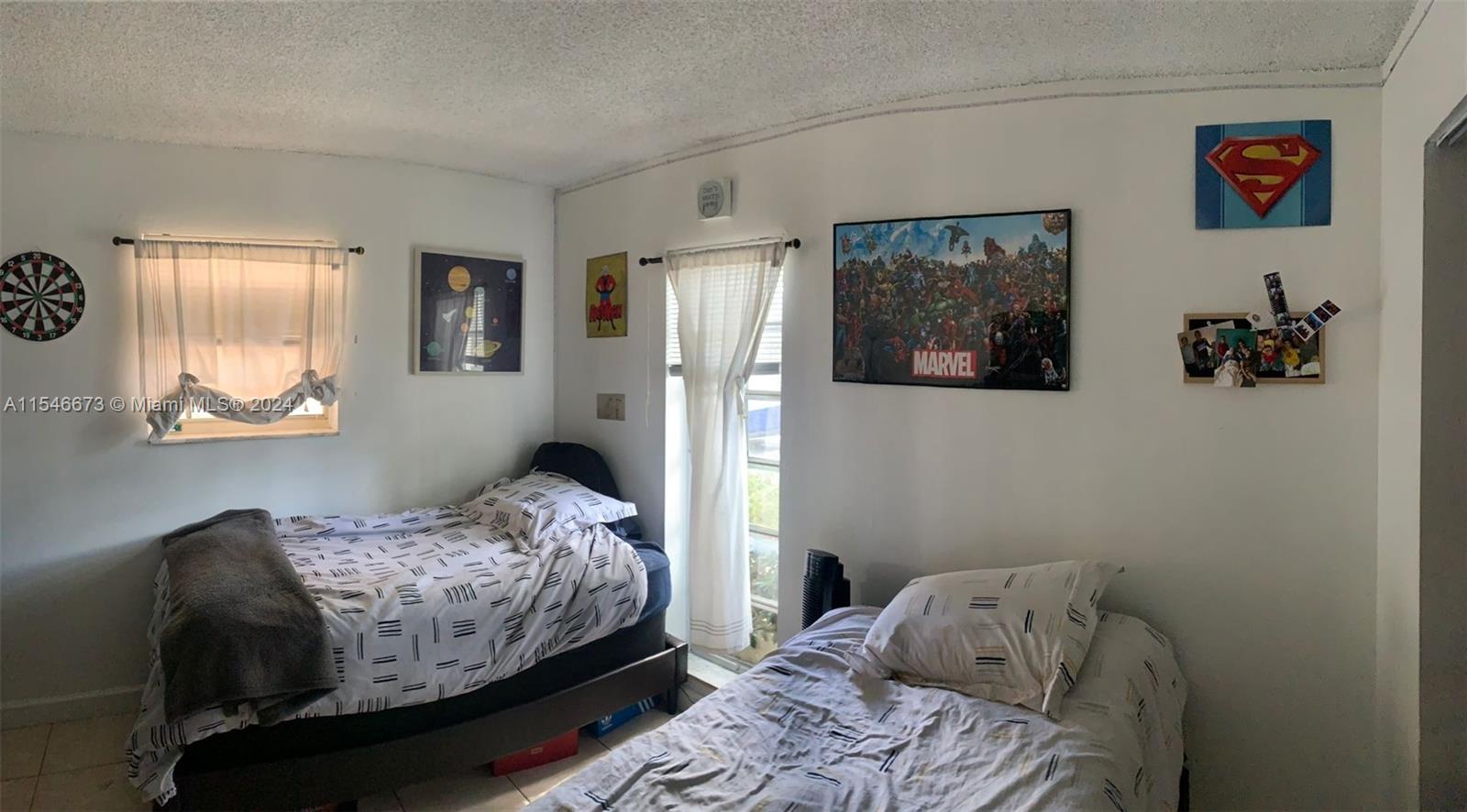 8550 Southwest 109th Avenue, Unit 5119 Miami, FL 33173 - Photo 13 of 14 a bedroom with a bed and a window