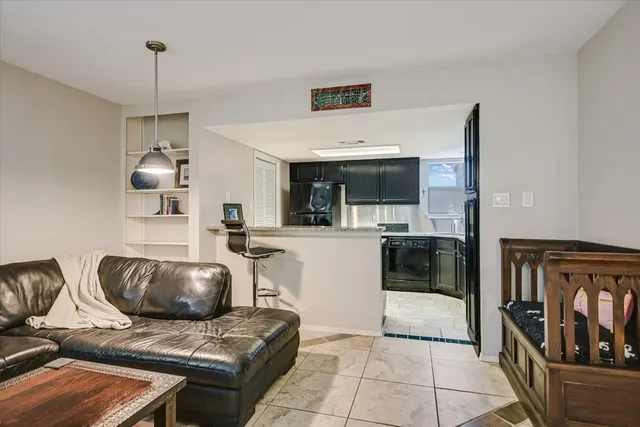a kitchen with a sink and a stove top oven