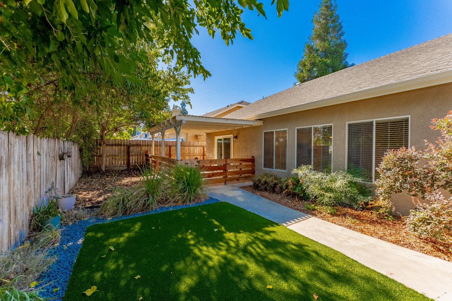 1963 Rialto Court Clovis, CA 93611 - Photo 32 of 36 a view of a house with backyard and garden