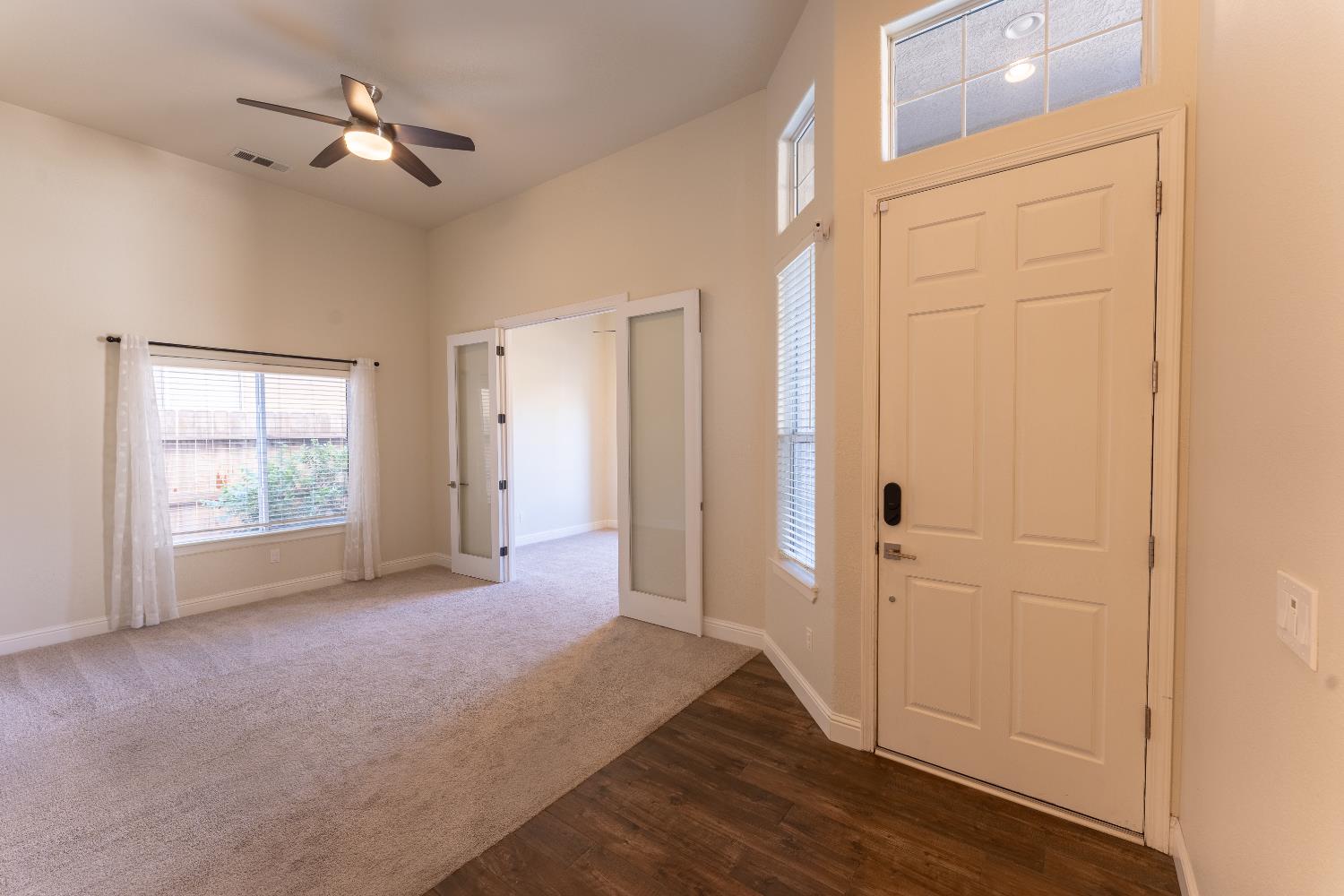 1963 Rialto Court Clovis, CA 93611 - Photo 6 of 36 a view of empty room with wooden floor and fan