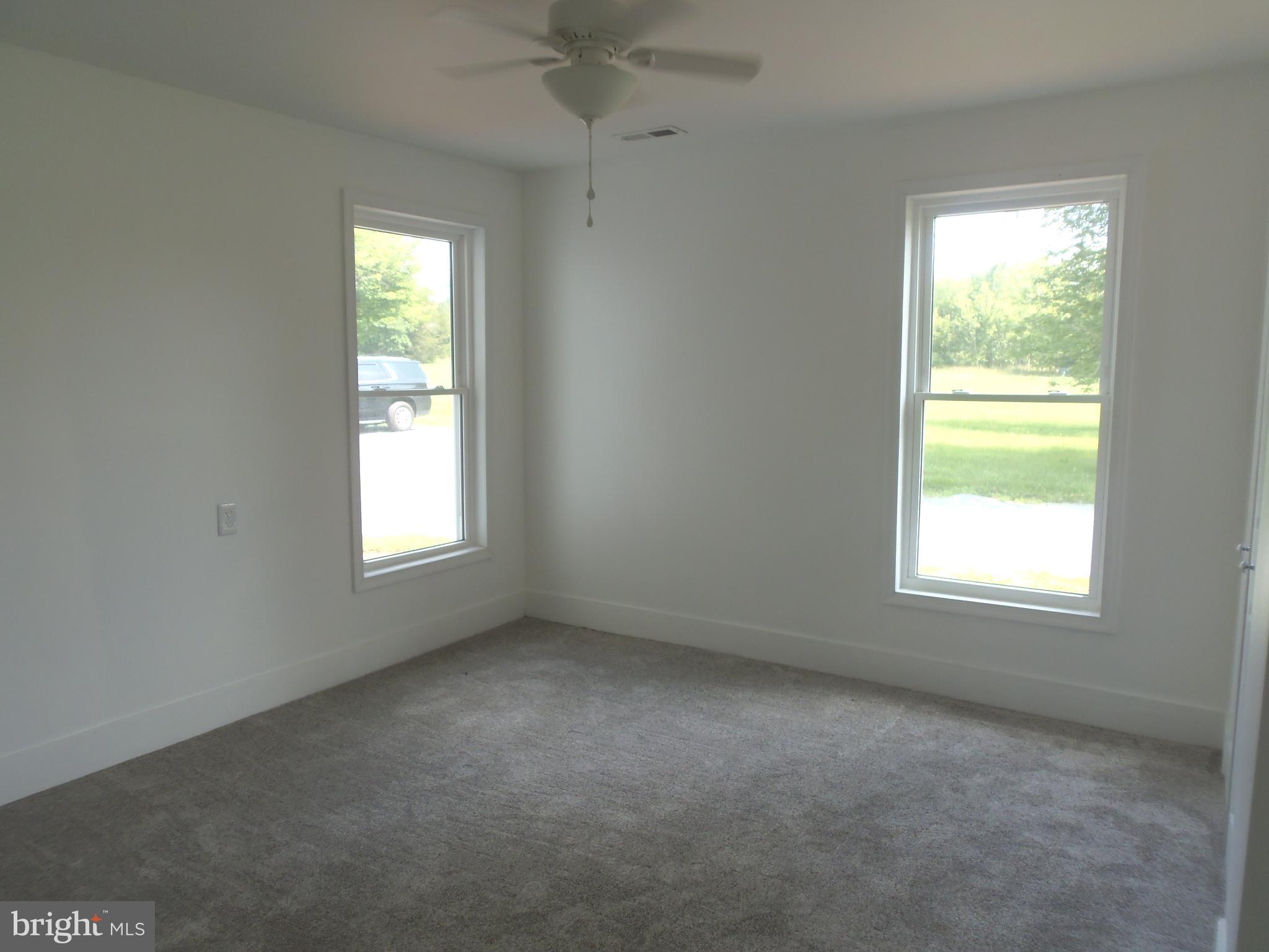 12058 Mitchell Road Mitchells, VA 22729 - Photo 20 of 38 an empty room with a window