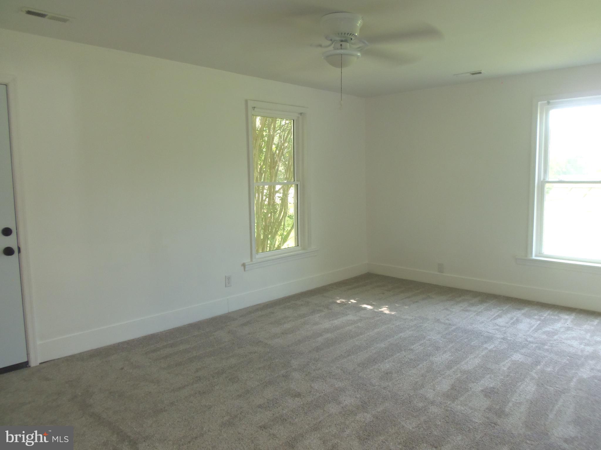 12058 Mitchell Road Mitchells, VA 22729 - Photo 23 of 38 an empty room with a window