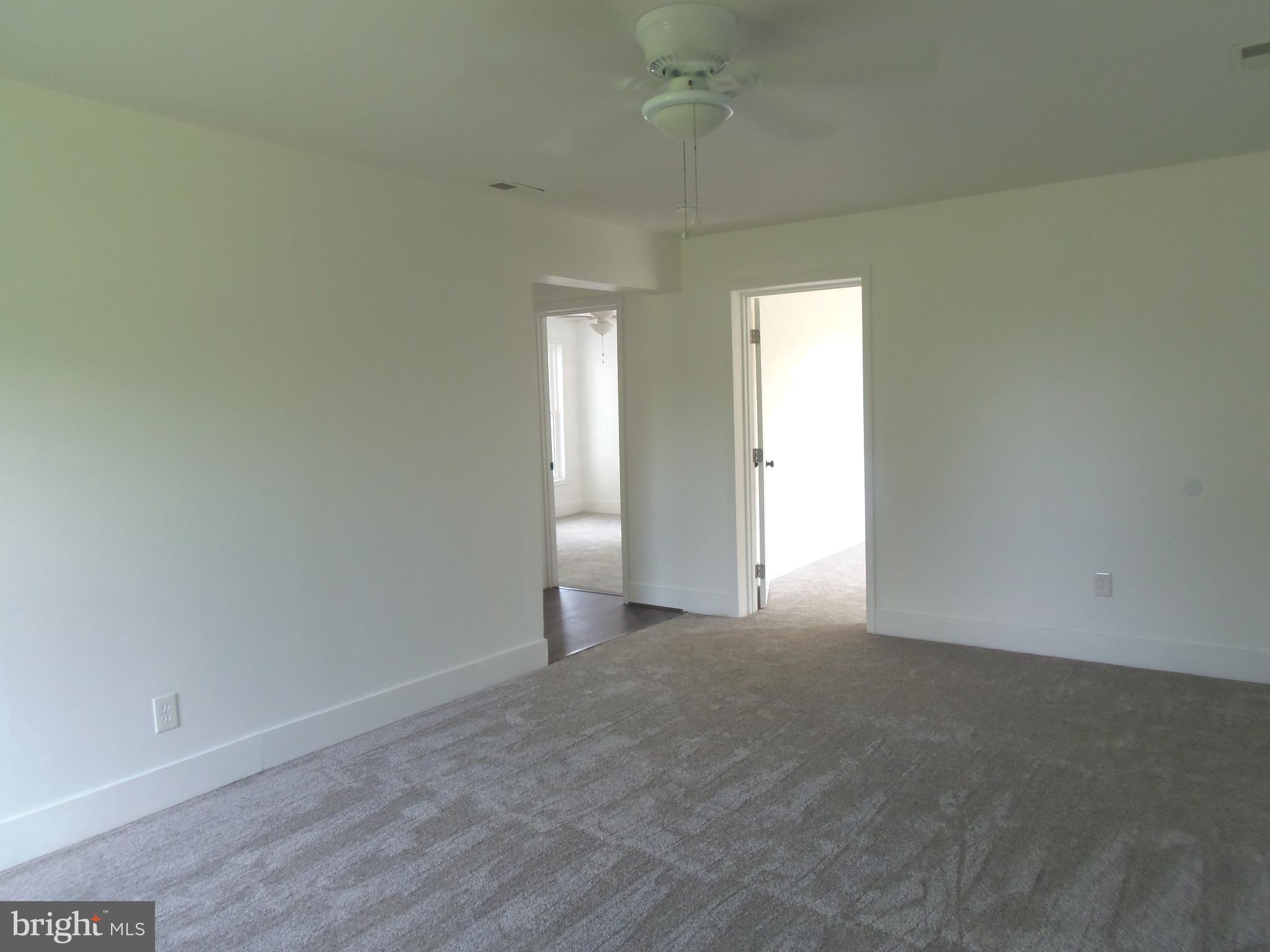 12058 Mitchell Road Mitchells, VA 22729 - Photo 24 of 38 an empty room with a empty space and windows