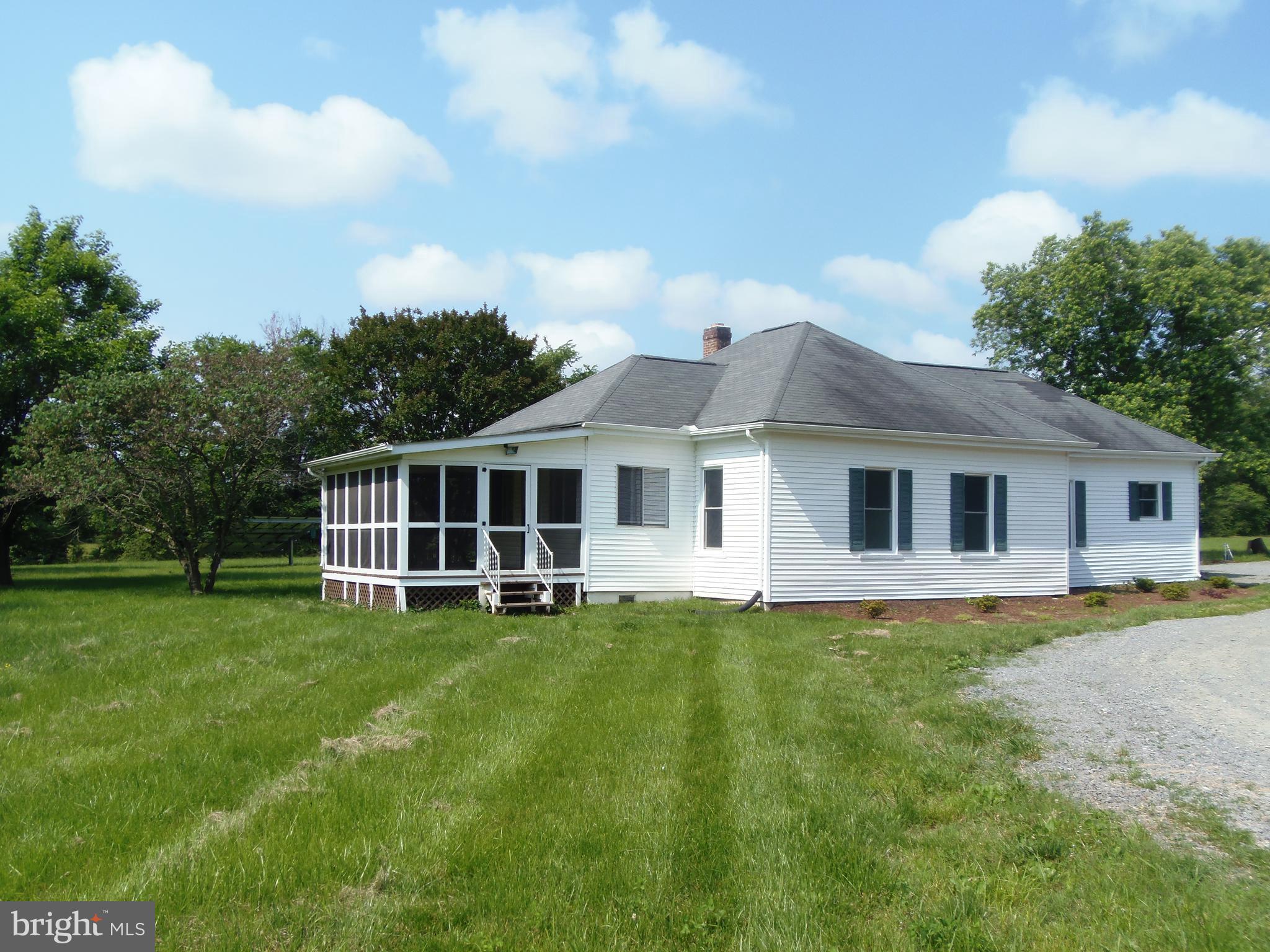 12058 Mitchell Road Mitchells, VA 22729 - Photo 3 of 38 a front view of a house with a garden