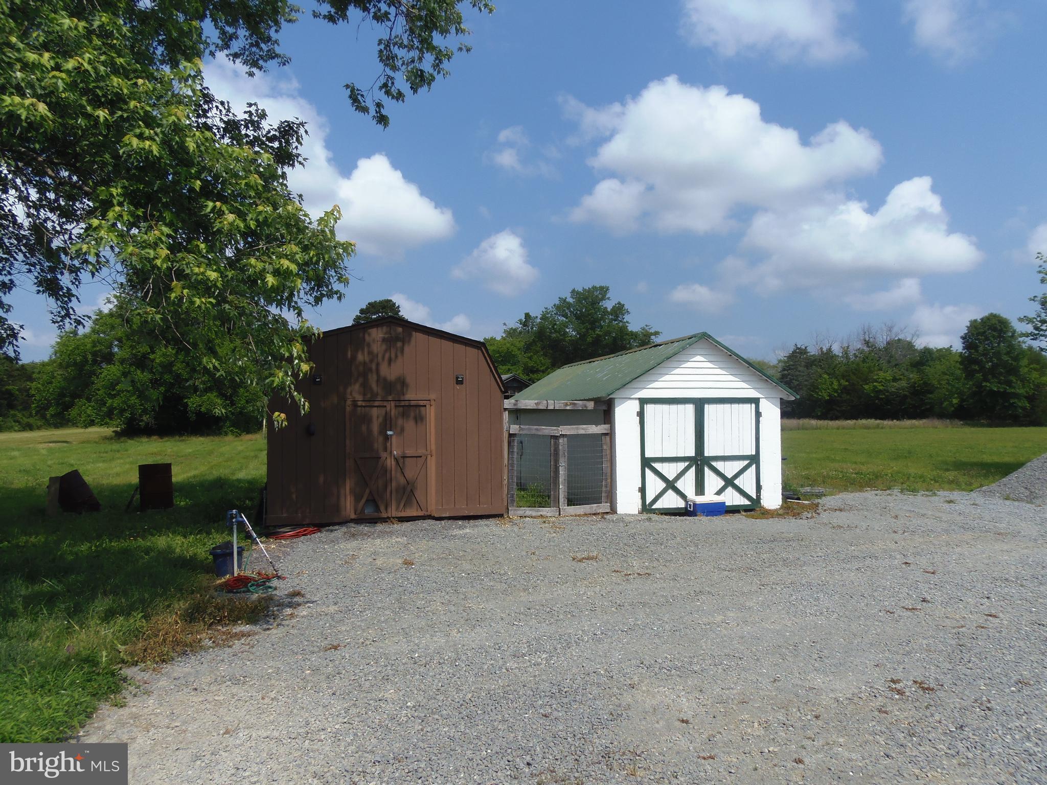 12058 Mitchell Road Mitchells, VA 22729 - Photo 32 of 38 a view of a house with a yard and large tree