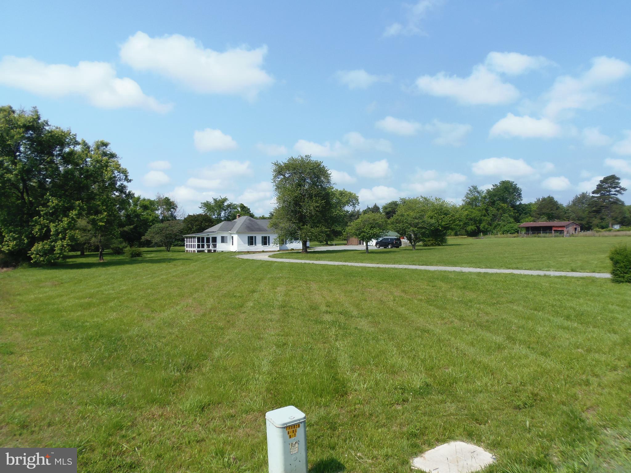 12058 Mitchell Road Mitchells, VA 22729 - Photo 5 of 38 a view of a golf course with a lake