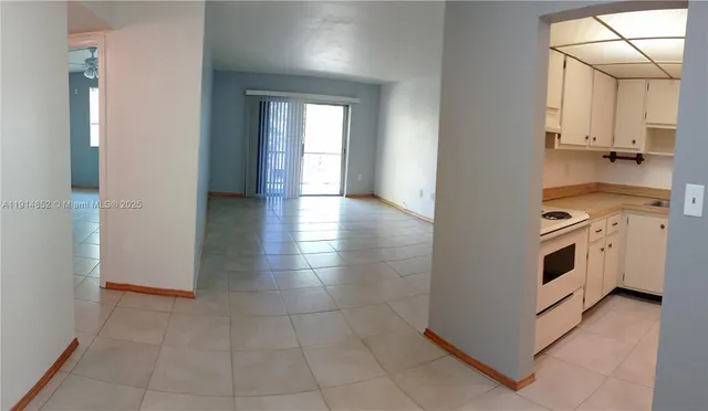 a view of a kitchen with a stove top oven