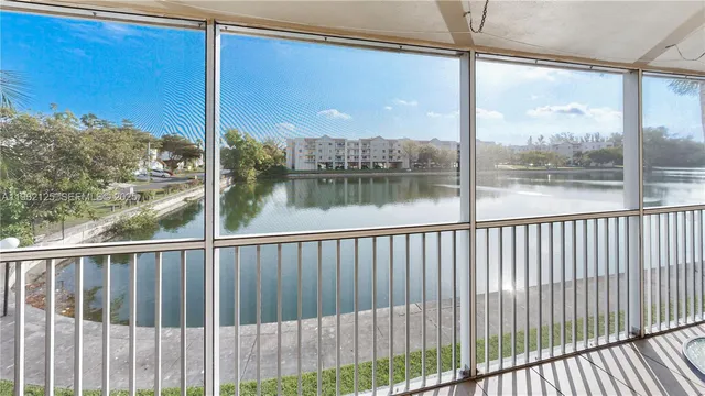 an aerial view of house with yard swimming pool and outdoor seating