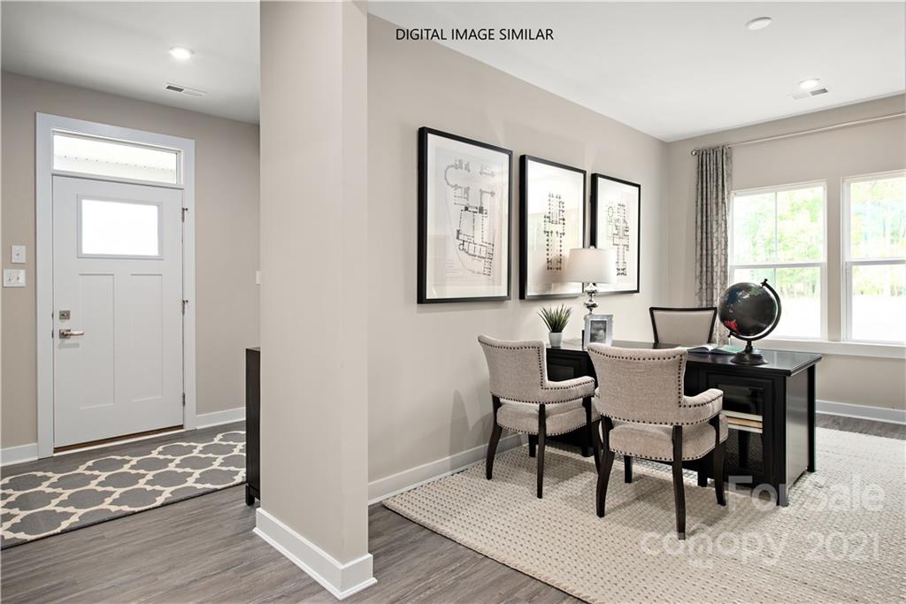 1619 Moore Farm Road, Unit 184 Indian Trail, NC 28079 - Photo 2 of 28 a view of a a dining room with furniture window and wooden floor