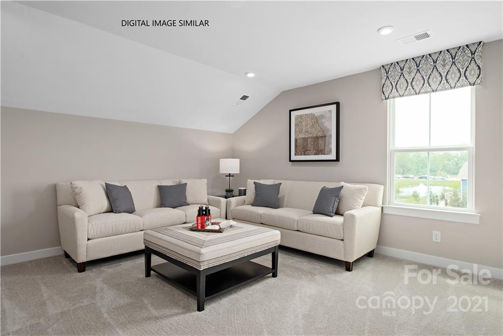 1619 Moore Farm Road, Unit 184 Indian Trail, NC 28079 - Photo 20 of 28 a living room with furniture and a large window